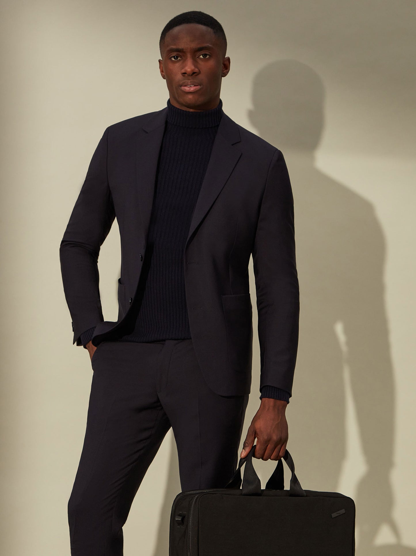 blue roll neck sweater, smart and comfortable for travel