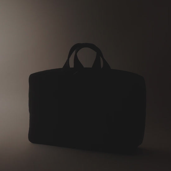 A stylish and functional men's overnight travel bag with multiple compartments