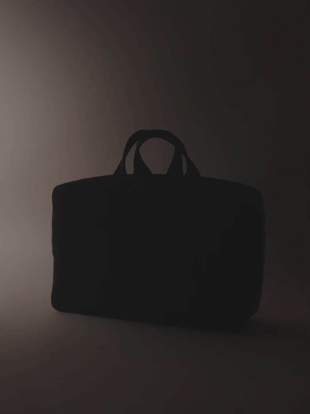 A stylish and functional men's overnight travel bag with multiple compartments